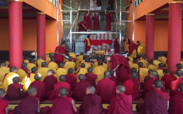 Buddhist Monks in a Prayer