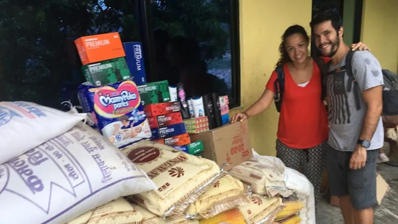 Volunteer Couple from Spain Donates food stuff to a children home.